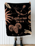 Woven tapestry throw blanket featuring the Aries and Sagittarius zodiac symbols. Perfect for astrology enthusiasts, this cotton throw blanket adds a touch of boho style and celestial charm to your home decor