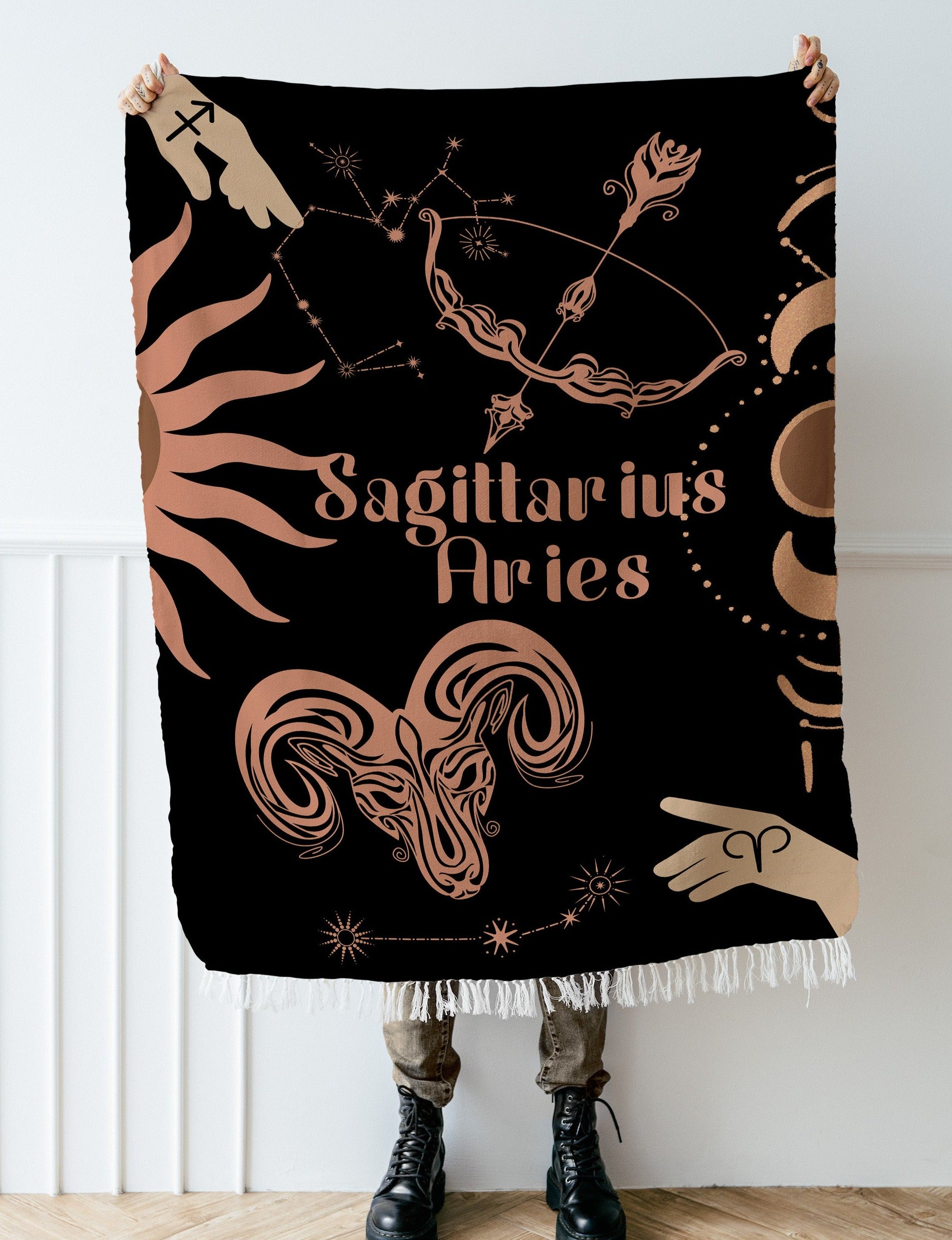 Woven tapestry throw blanket featuring the Aries and Sagittarius zodiac symbols. Perfect for astrology enthusiasts, this cotton throw blanket adds a touch of boho style and celestial charm to your home decor