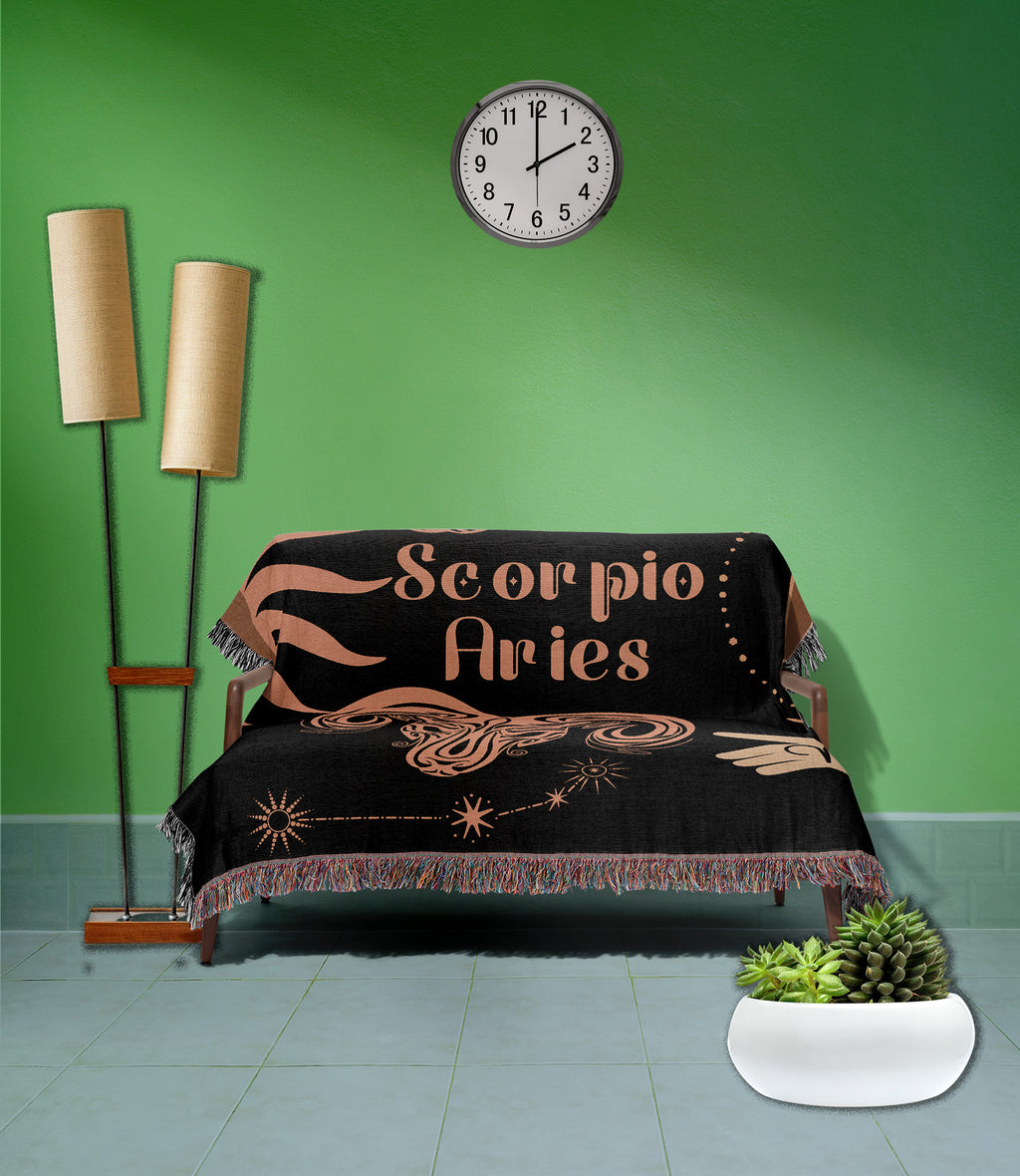 Woven tapestry throw blanket featuring the Aries and Scorpio zodiac symbols. Perfect for astrology enthusiasts, this cotton throw blanket adds a touch of boho style and celestial charm to your home decor.