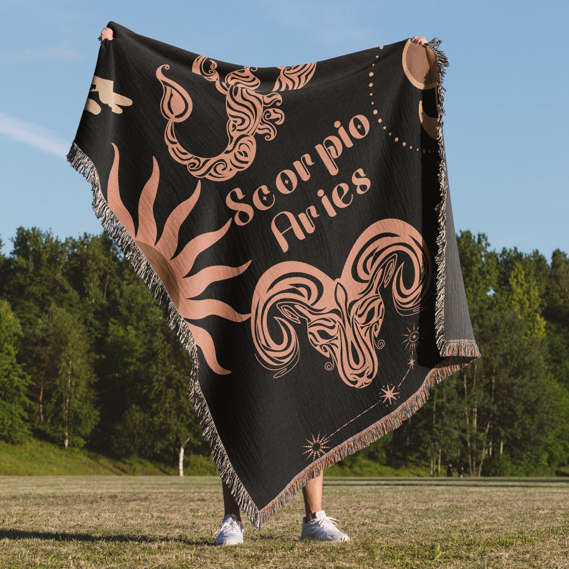 Woven tapestry throw blanket featuring the Aries and Scorpio zodiac symbols. Perfect for astrology enthusiasts, this cotton throw blanket adds a touch of boho style and celestial charm to your home decor.
