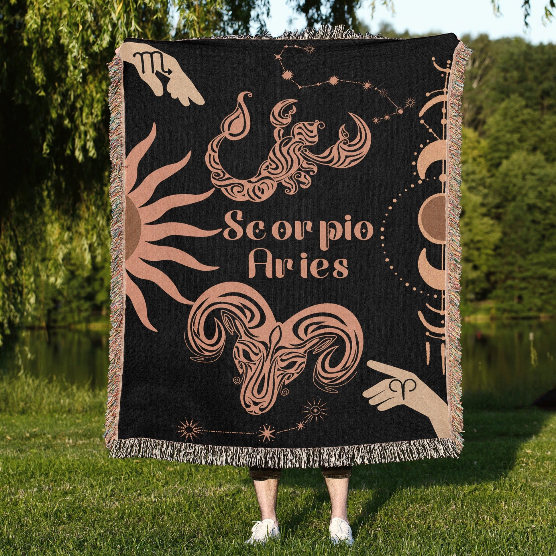 Woven tapestry throw blanket featuring the Aries and Scorpio zodiac symbols. Perfect for astrology enthusiasts, this cotton throw blanket adds a touch of boho style and celestial charm to your home decor.
