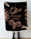 Woven tapestry throw blanket featuring the Aries and Scorpio zodiac symbols. Perfect for astrology enthusiasts, this cotton throw blanket adds a touch of boho style and celestial charm to your home decor.
