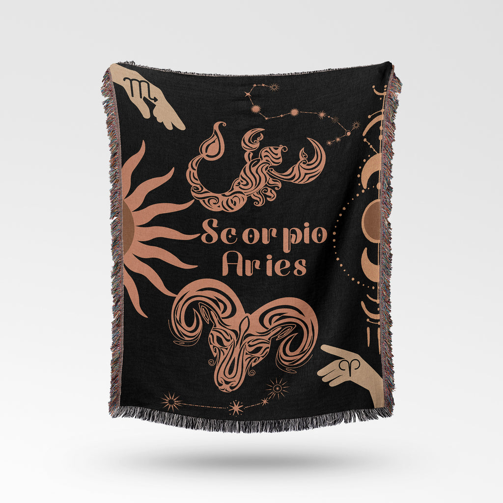 Woven tapestry throw blanket featuring the Aries and Scorpio zodiac symbols. Perfect for astrology enthusiasts, this cotton throw blanket adds a touch of boho style and celestial charm to your home decor.