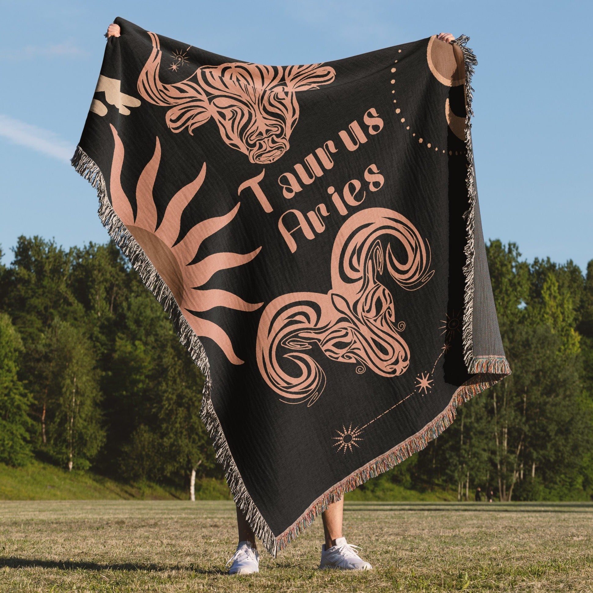 Woven tapestry throw blanket featuring the Aries and Taurus zodiac symbols. Perfect for astrology enthusiasts, this cotton throw blanket adds a touch of boho style and celestial charm to your home decor.