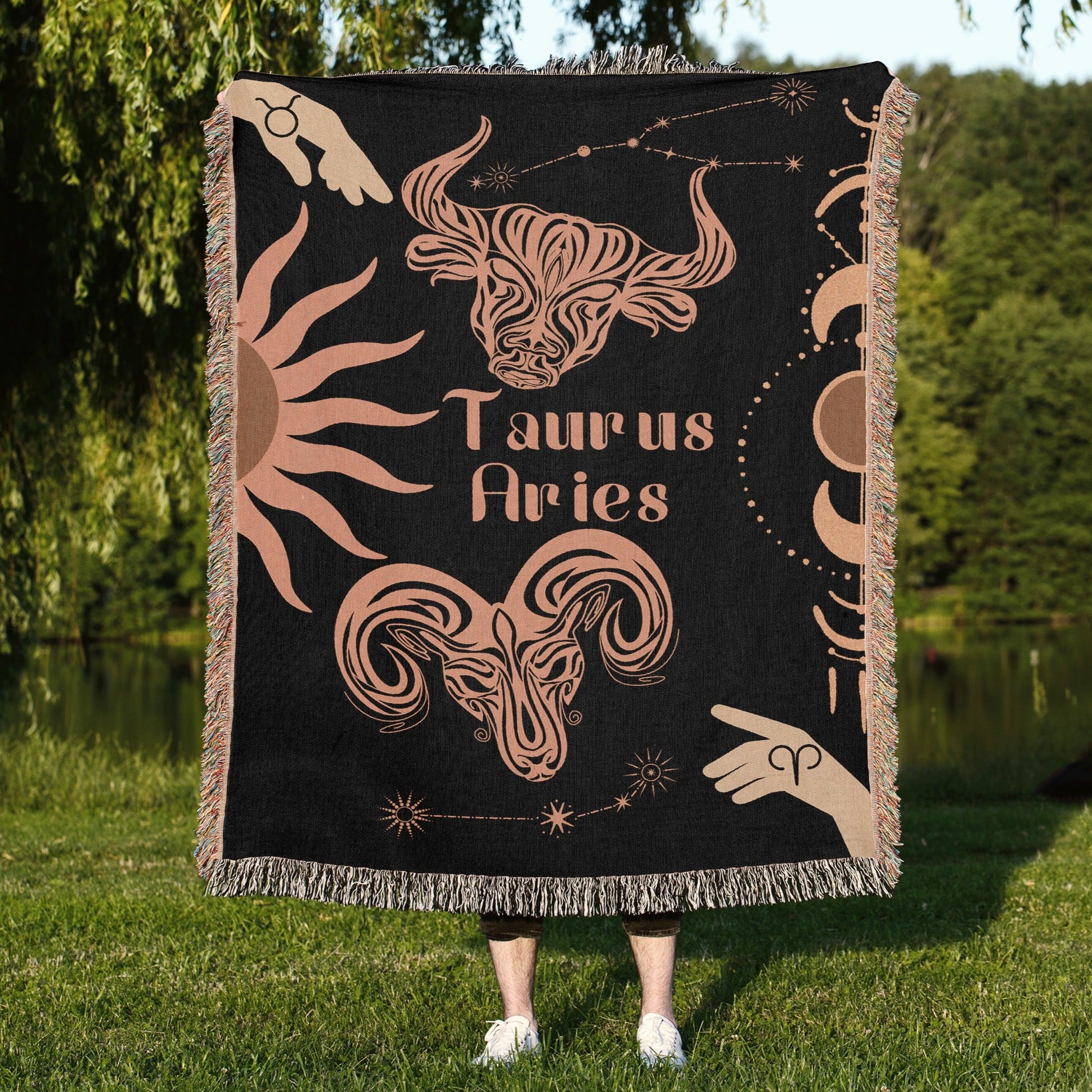 Woven tapestry throw blanket featuring the Aries and Taurus zodiac symbols. Perfect for astrology enthusiasts, this cotton throw blanket adds a touch of boho style and celestial charm to your home decor.