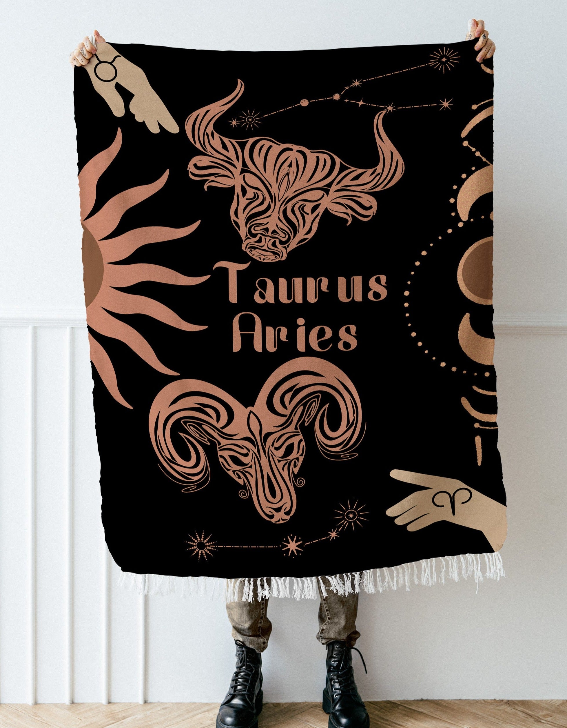 Woven tapestry throw blanket featuring the Aries and Taurus zodiac symbols. Perfect for astrology enthusiasts, this cotton throw blanket adds a touch of boho style and celestial charm to your home decor.