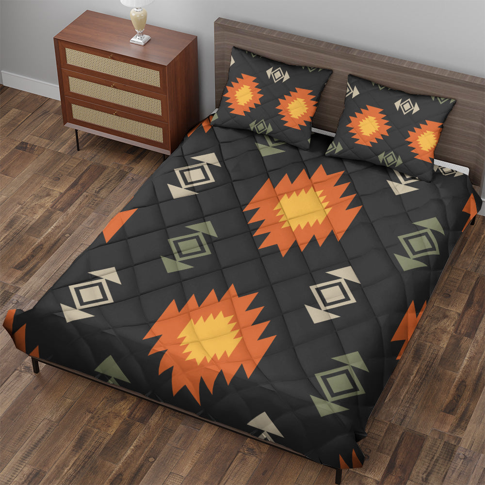 Angled view of black Southwestern quilted bedding set with matching pillowcases