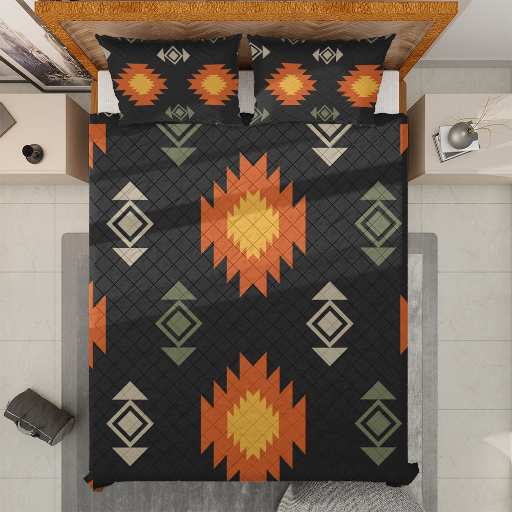 Black boho quilted bedspread and matching pillows shown from above
