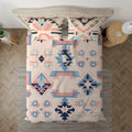 Pink and blue geometric boho duvet cover shown from above