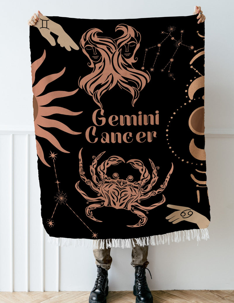 Cancer and Gemini Zodiac Compatibility Woven Throw Tapestry - Elevate home decor with this boho-inspired, celestial charm blanket. Perfect for astrology enthusiasts, featuring Aries and Gemini sun signs, adding unique, artistic flair to your living space. Premium cotton, cozy, and decorative.