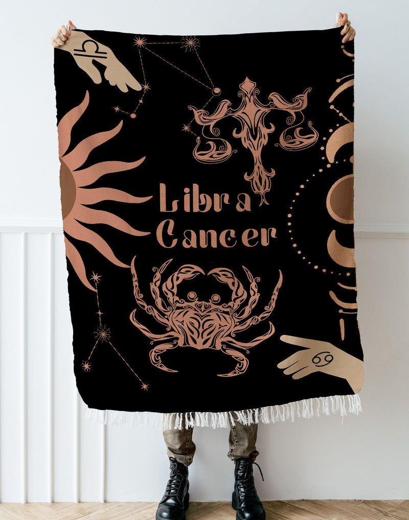 Cancer and Libra Zodiac Compatibility Woven Throw Tapestry - Elevate home decor with this boho-inspired, celestial charm blanket. Perfect for astrology enthusiasts, featuring Cancer and Libra sun signs, adding unique, artistic flair to your living space. Premium cotton, cozy, and decorative.