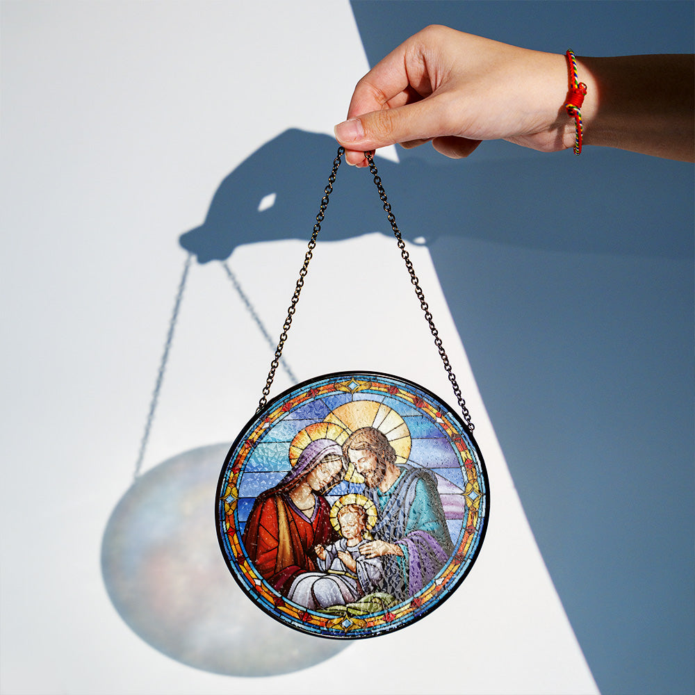 Nativity scene glass suncatcher with chain displayed as holiday window decoration