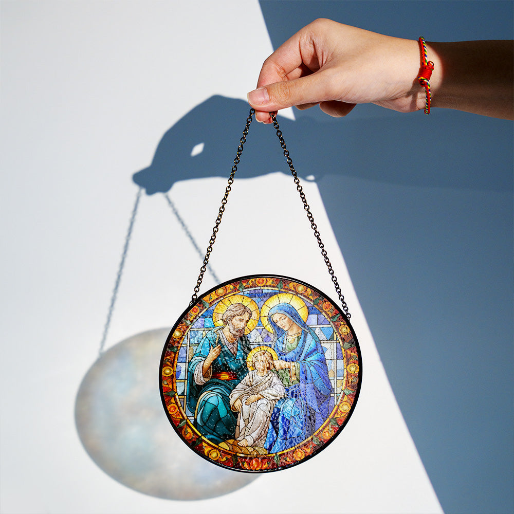 Holy Family stained glass suncatcher displayed as Christian Christmas window decor