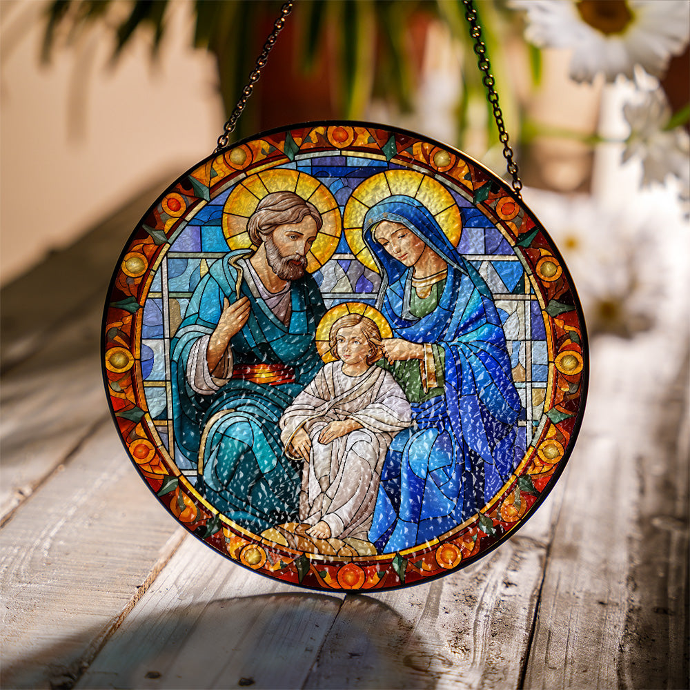 Holy Family stained glass suncatcher showing colorful light effect near a window