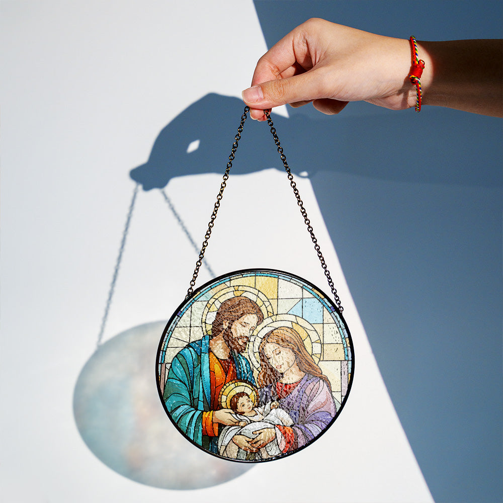 Holy Family Christmas stained glass suncatcher hanging in natural light