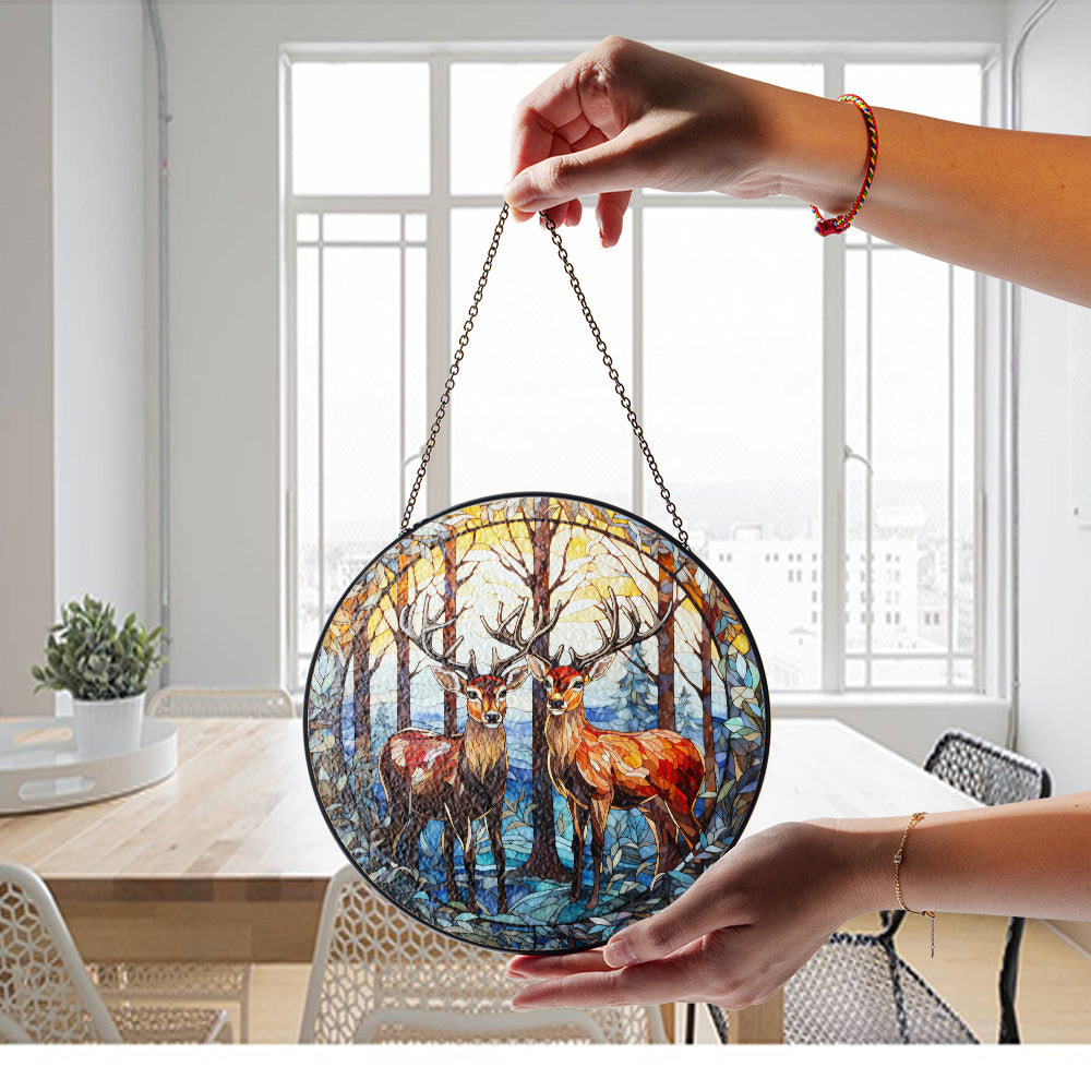 Winter reindeer glass suncatcher hanging near a window