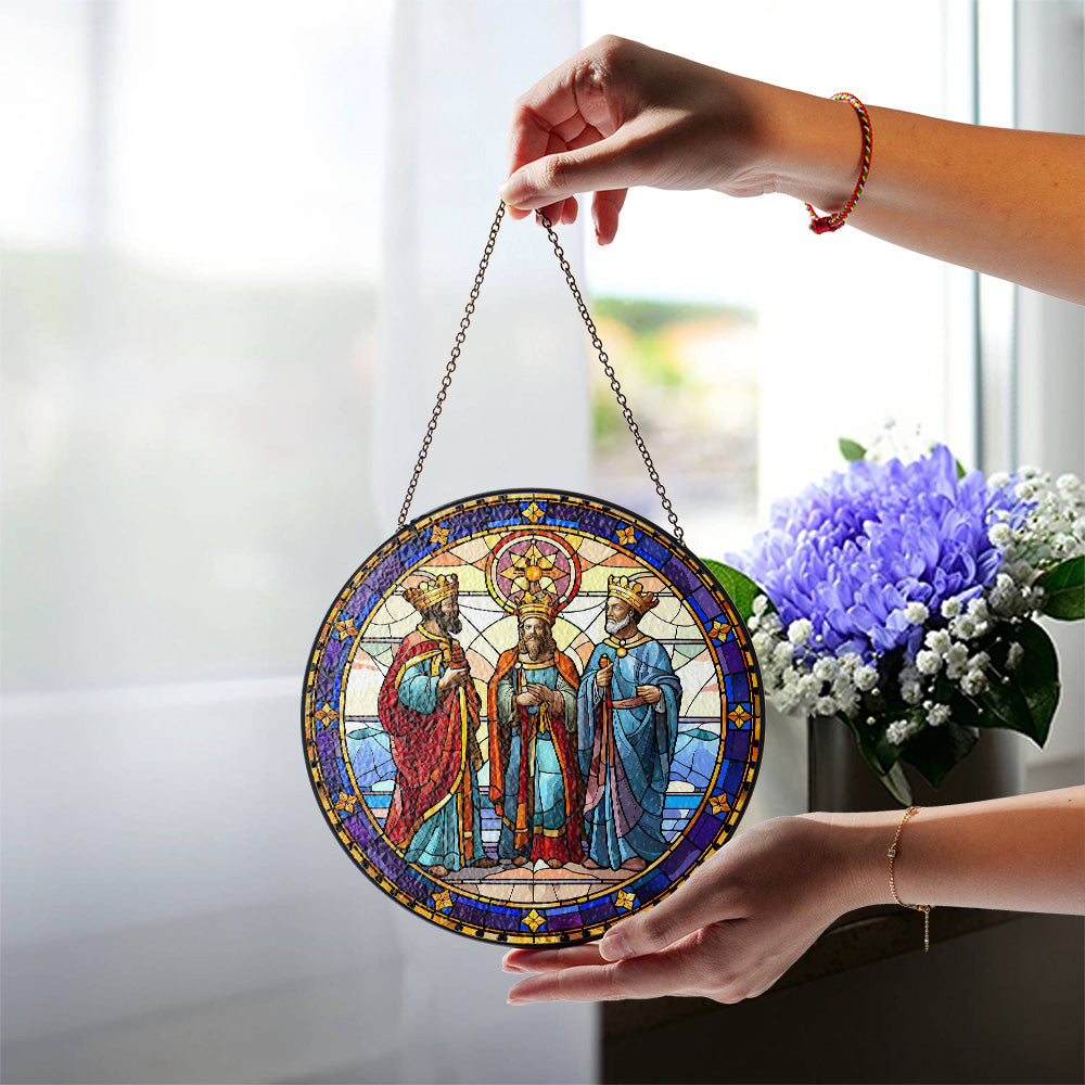 Biblical Three Wise Men glass suncatcher held by a window in natural light