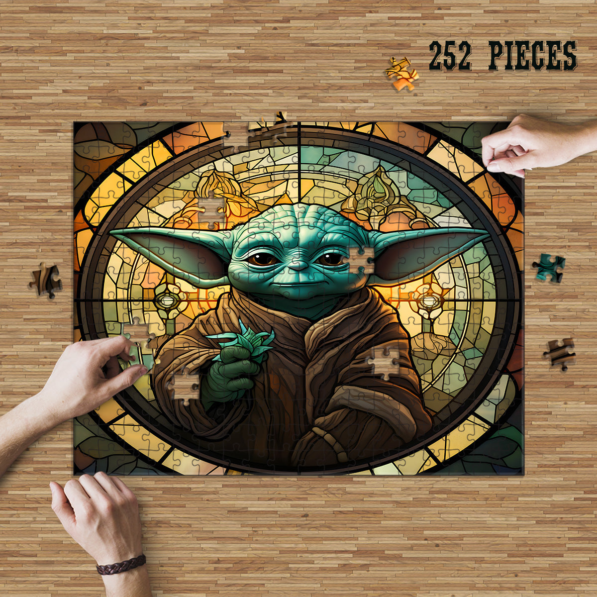 Hands assembling the 252-piece Green Fantasy Sage Stained Glass wooden jigsaw puzzle