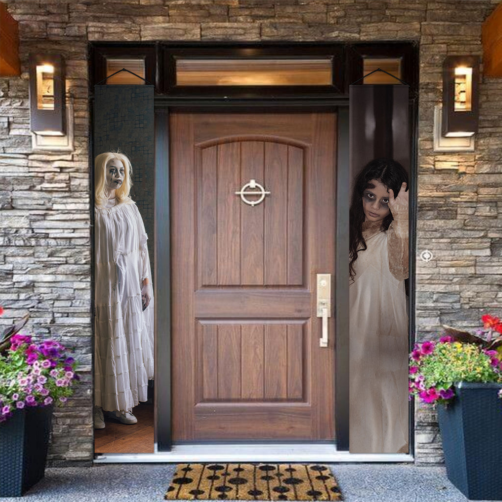 Women in White Halloween door banners with two creepy ghostly figures.