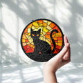 Black Cat Halloween window decoration with orange and yellow artwork