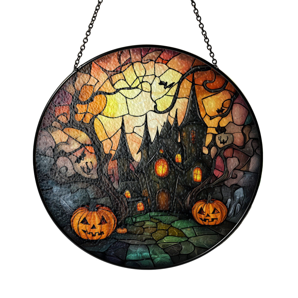 Halloween-themed stained glass panel with pumpkins and a haunted house.