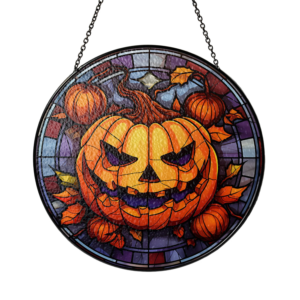 Stained glass window with a Halloween design featuring pumpkins and leaves.