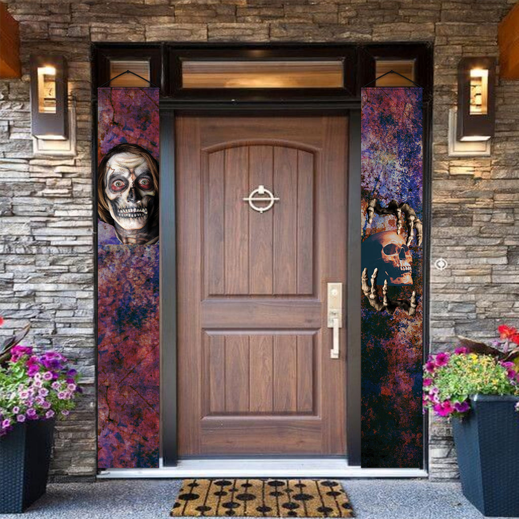 Skull and skeleton Halloween door banners displayed beside a front door