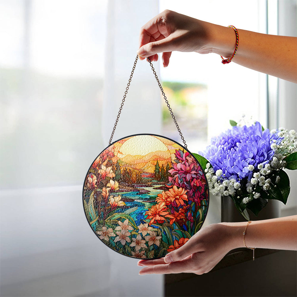 Floral stained glass suncatcher with mountain sunset and blue water