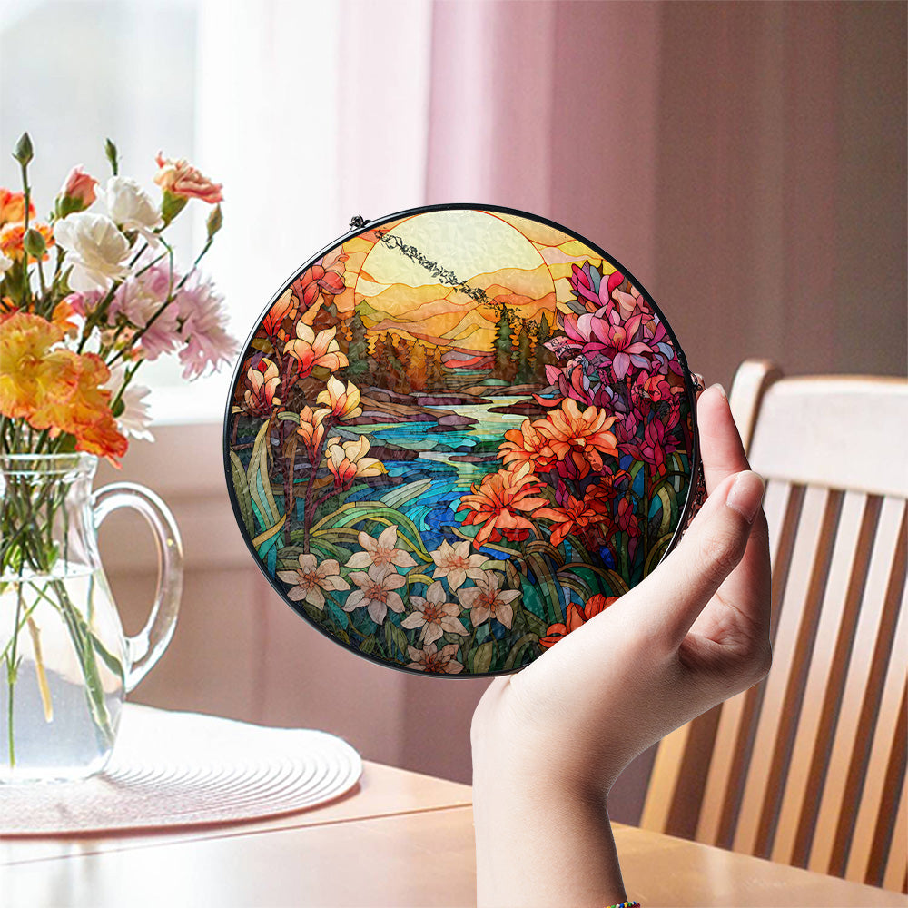 Nature sunset glass window hanging displayed in natural light
