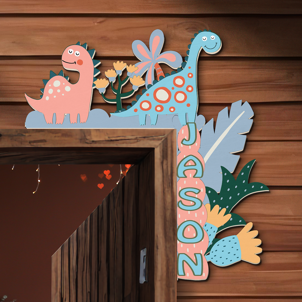 Decorative nameplate with cartoon dinosaurs and flowers on a wooden background