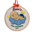 Personalized baby's first Christmas embroidered hoop ornament with sleeping baby on blue cloud, moon and star – main product view