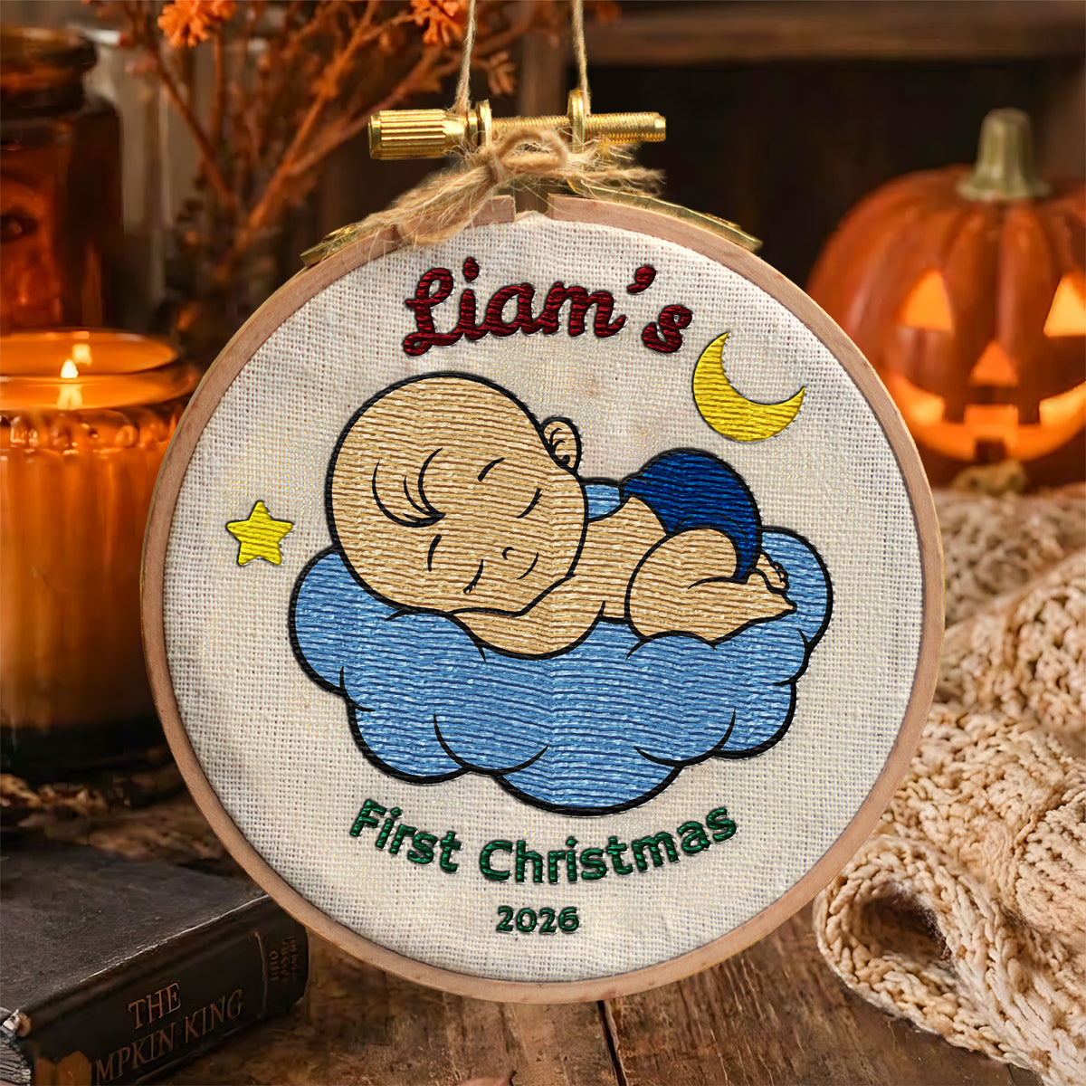 Personalized baby's first Christmas embroidered hoop ornament with sleeping baby on blue cloud, moon and star – alternate hoop ornament product view