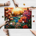 A rectangular jigsaw puzzle with a stained glass art design depicting a sunset and flowers, being assembled by people with visible hands and pieces.